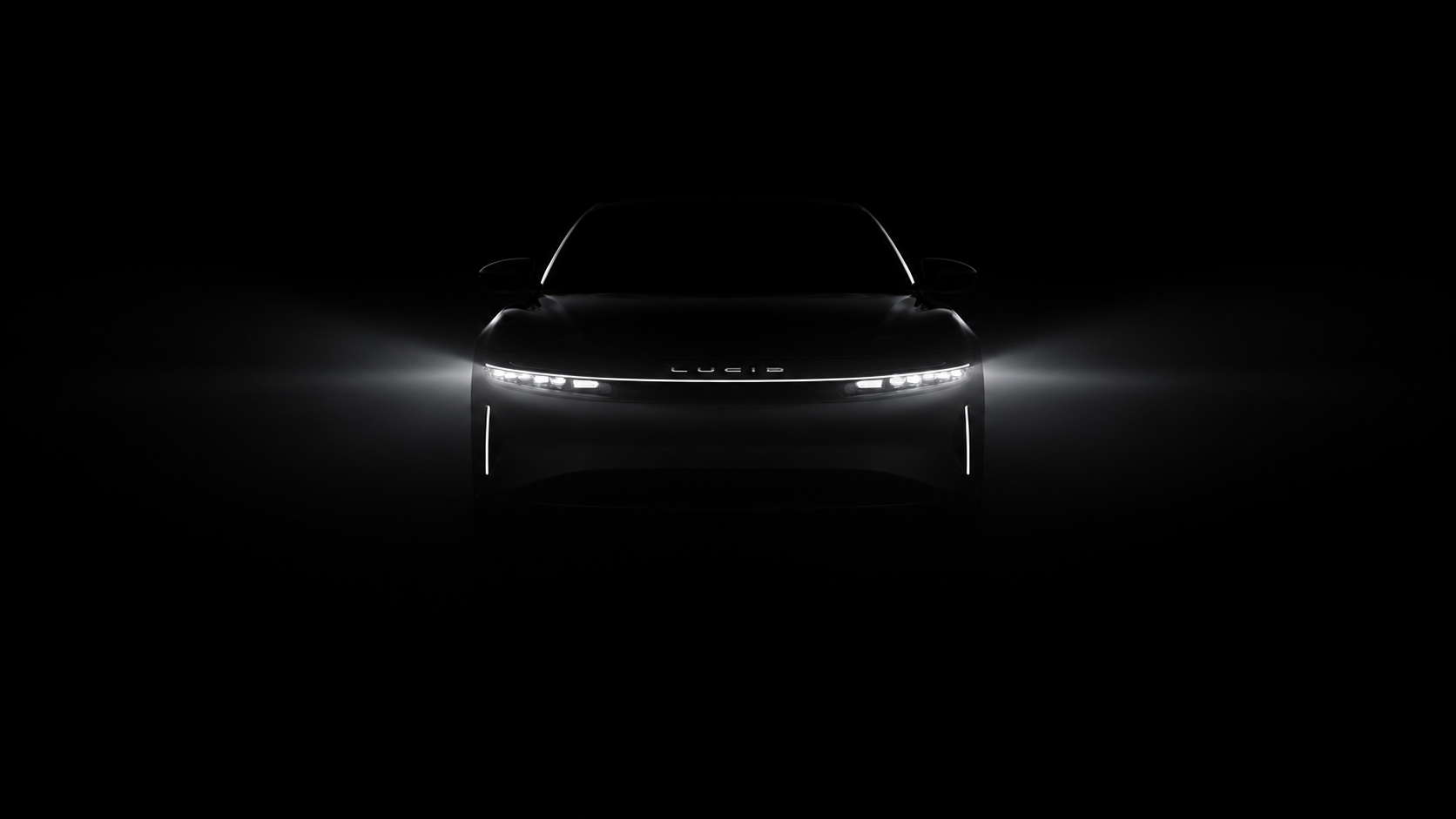 Lucid Air front lighting in a dark studio